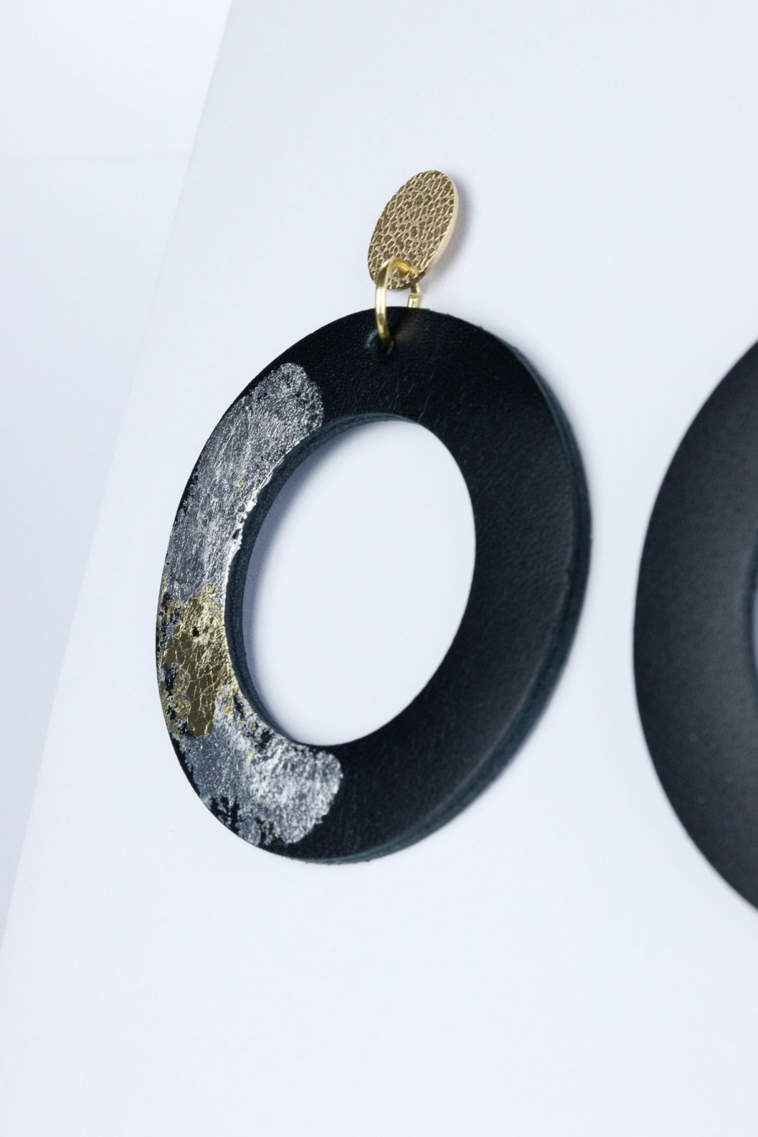 Unique circle earrings with applied gold leaf