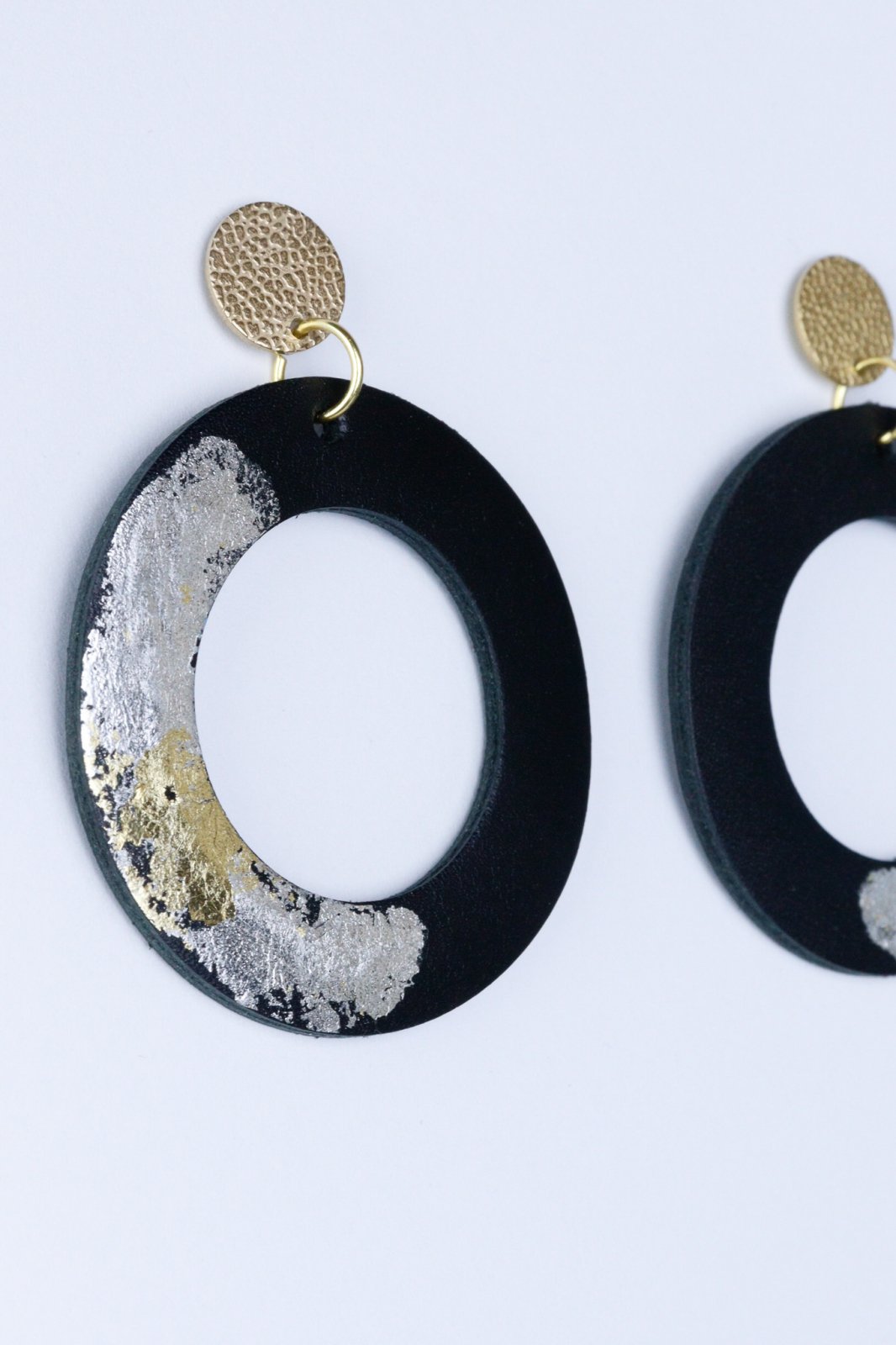 Unique circle earrings with applied gold leaf