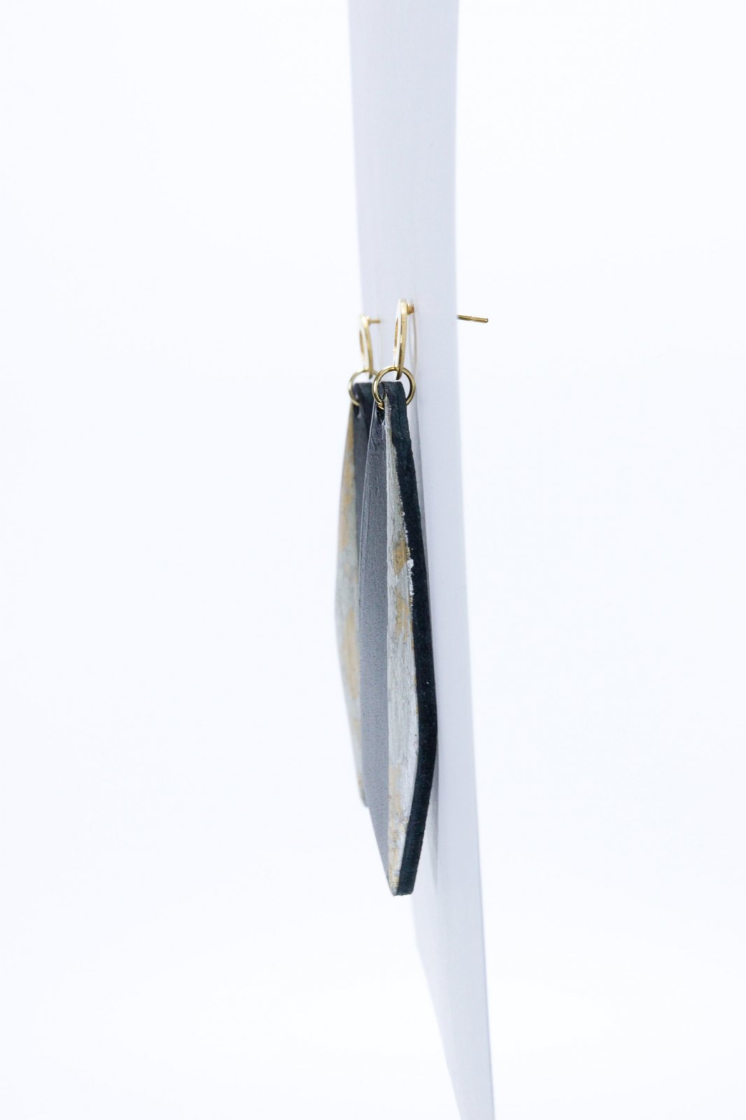 Unique earrings with applied gold leaf